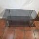 Smoked glass and brass coffee table from the 1970s.