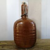 Old bottle of varnished sandstone