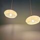 Pair of Art Deco light fixtures in light green speckled glass, 1930s.