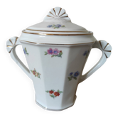 Antique porcelain sugar bowl with a decagonal base.