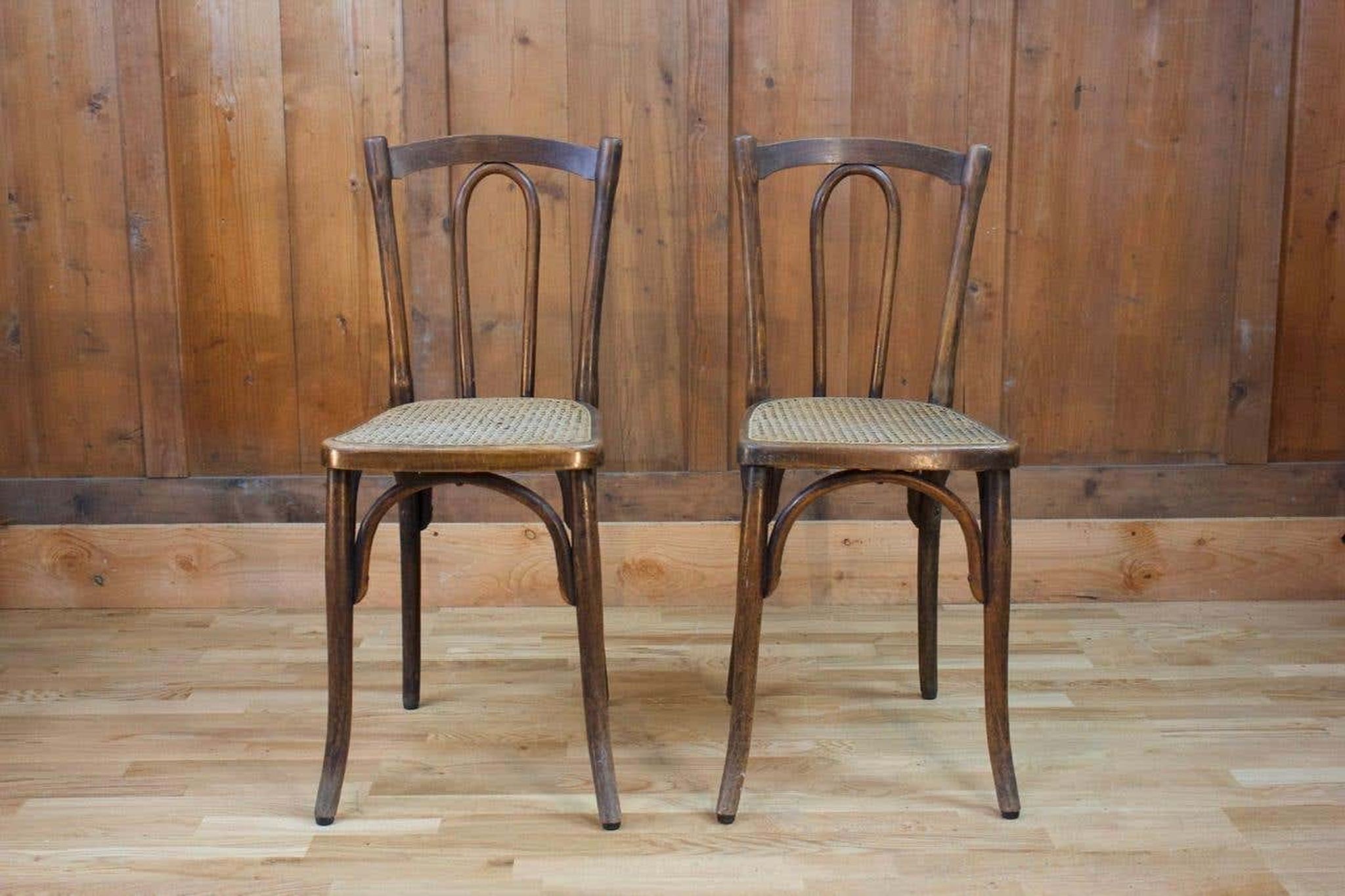 Pair of wooden bistro chairs, 20th century, France