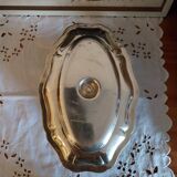 Sauce boat on a scalloped tray in silver metal