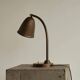 Art Deco table lamp in patinated brass from the 1930s.