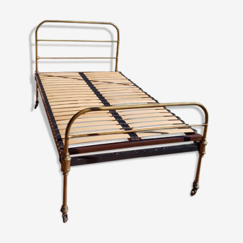 Brass bed with slatted box spring