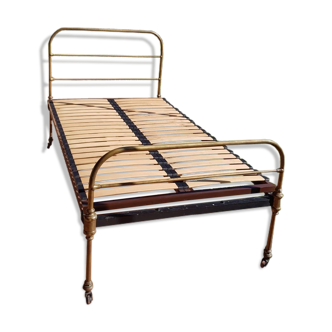 Brass bed with slatted box spring