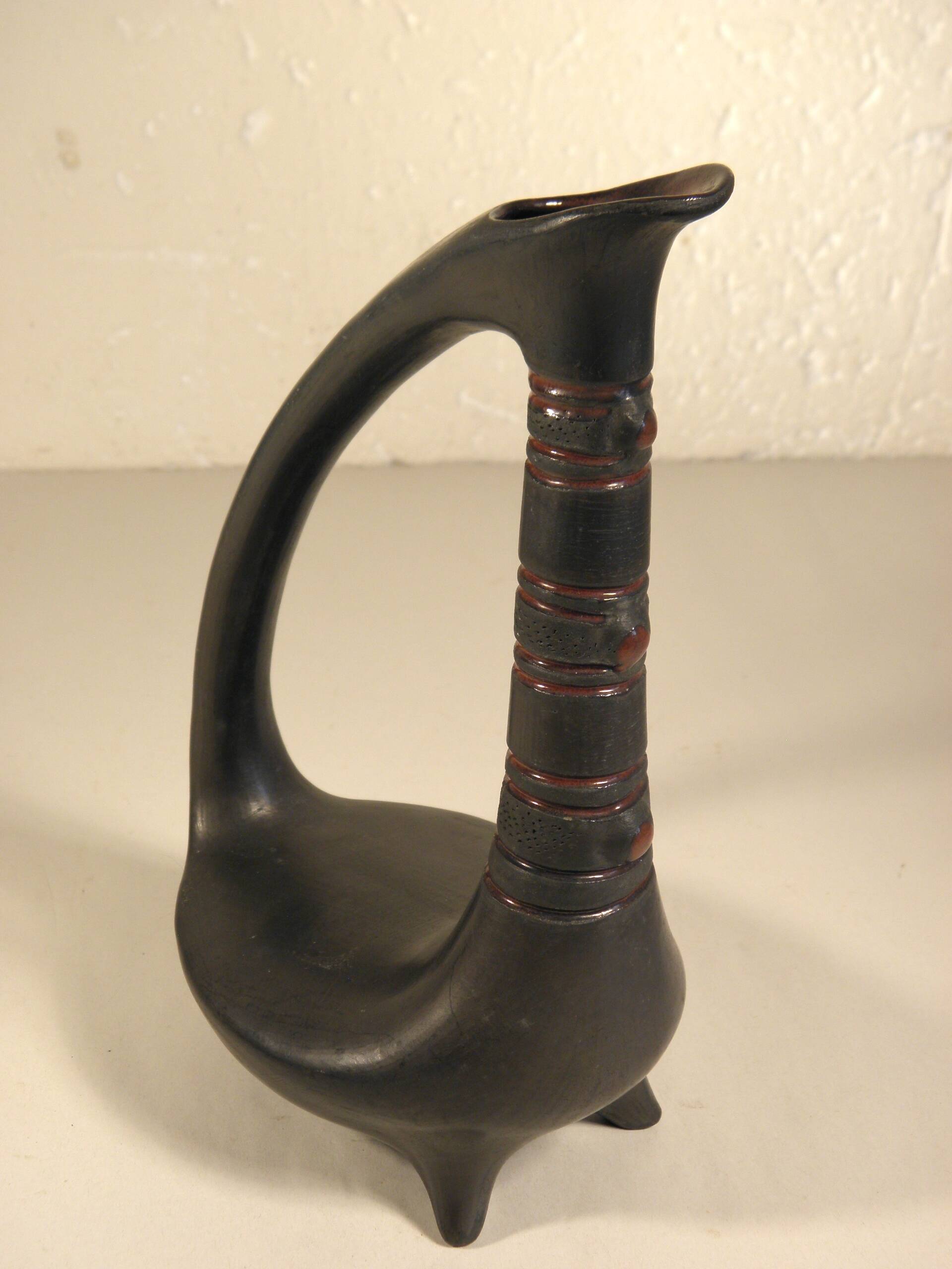 Zoomorphic pitcher vase in black ceramic