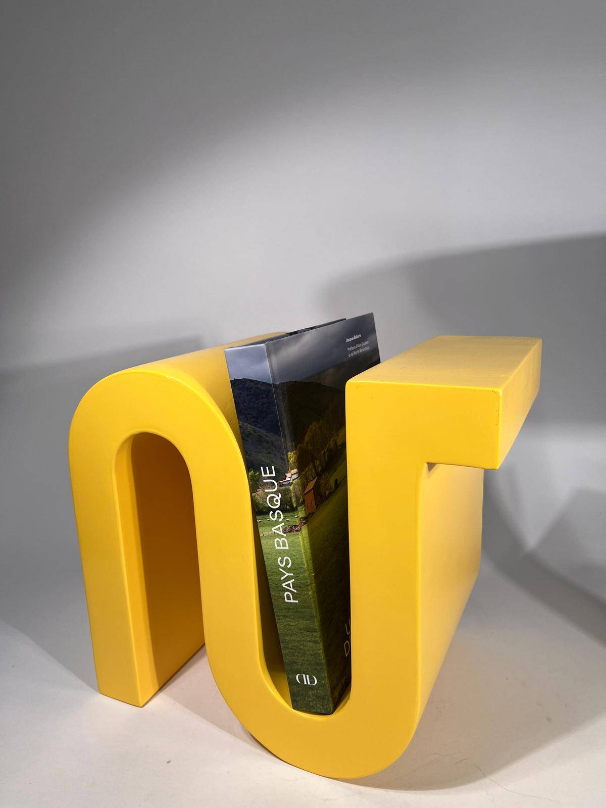 Yellow book or magazine holder by Axel Chay for Monorpix