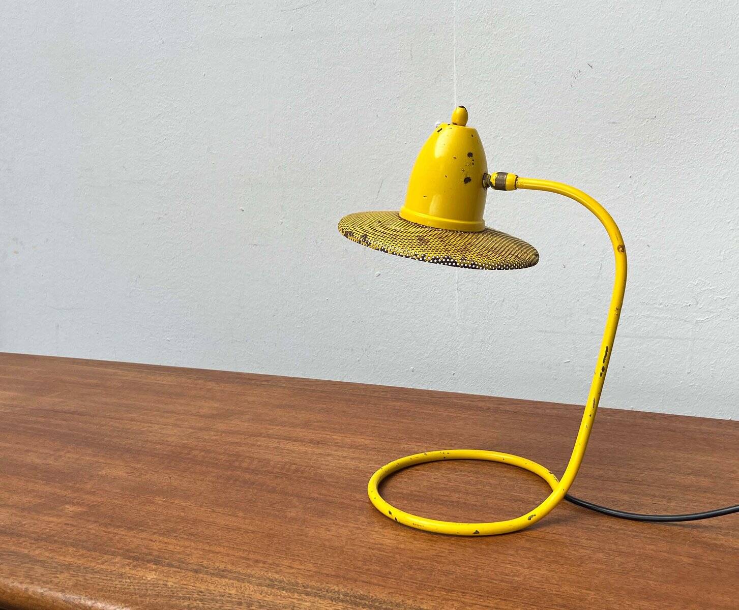 Perforated metal table lamp in Mid-Century Modern style, in the style of Mathieu Matégot, 1960s.