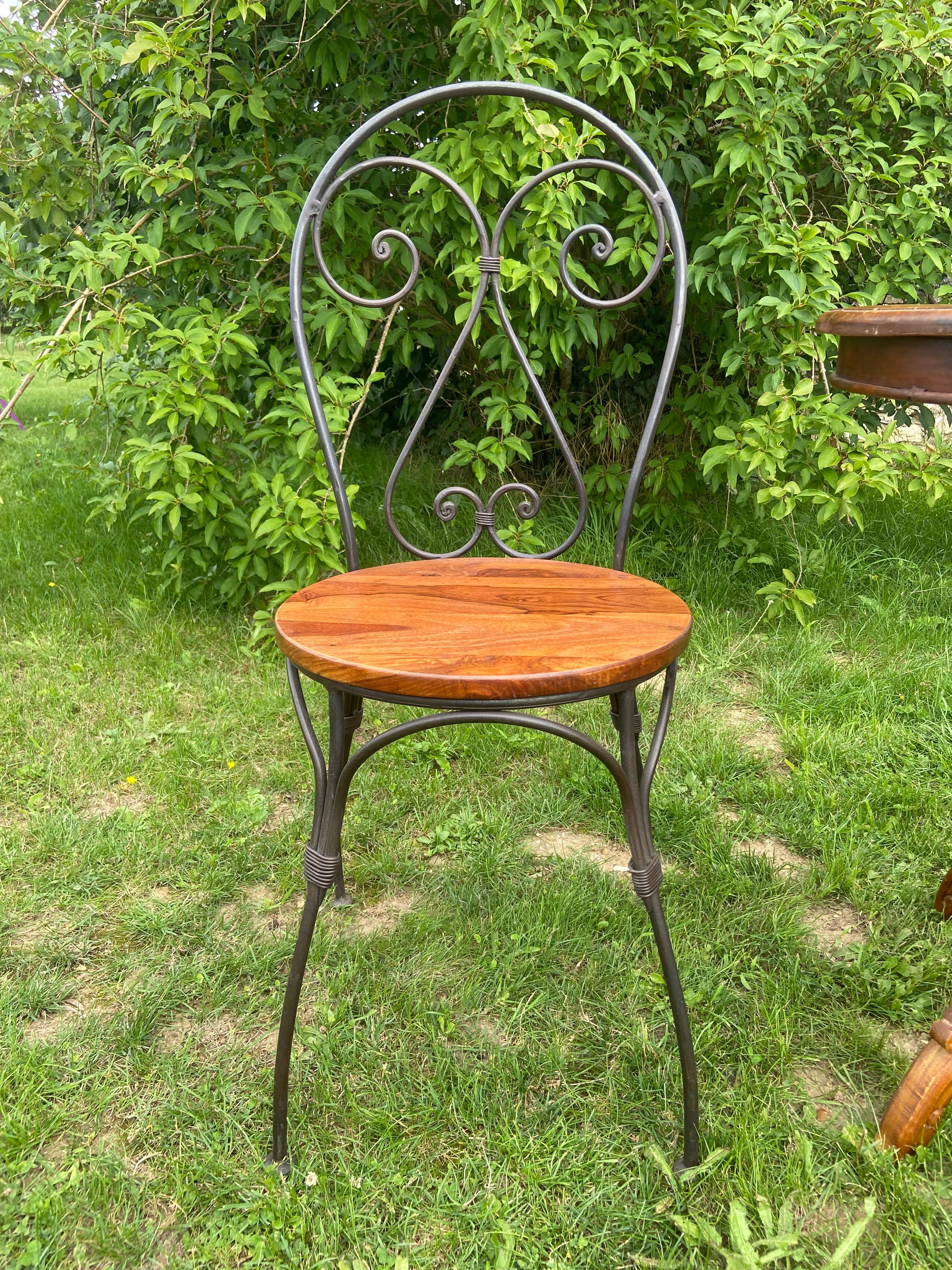 Round table and wrought iron chair