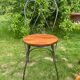 Round table and wrought iron chair