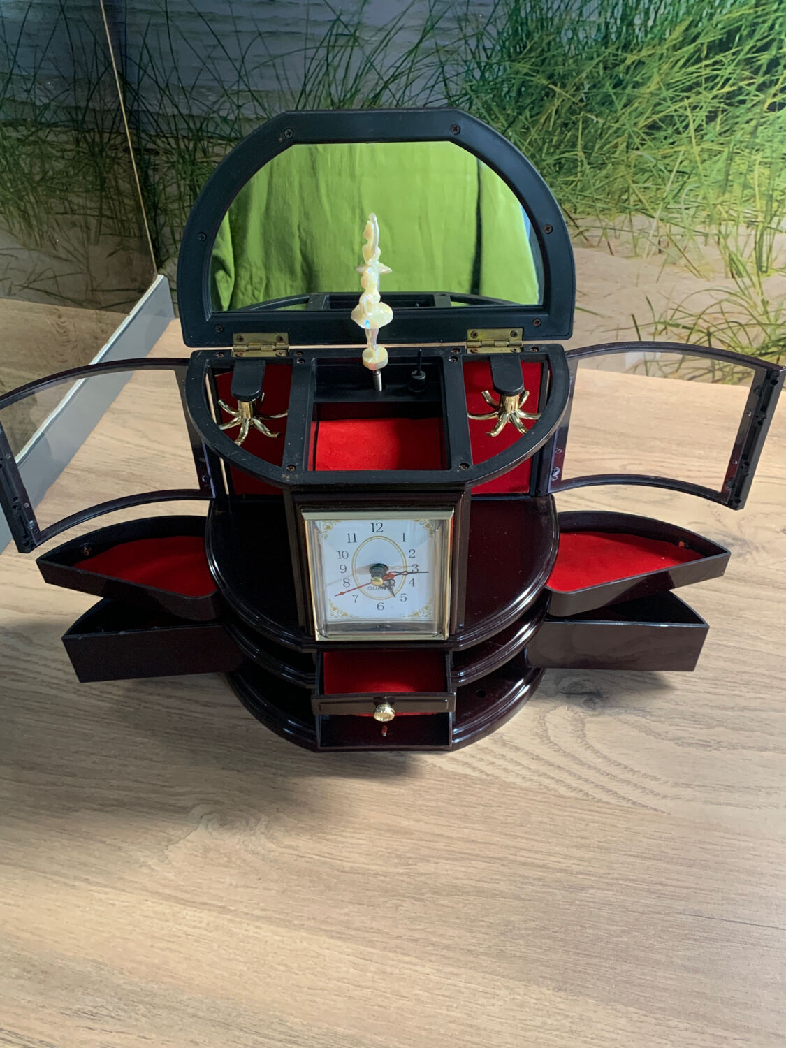 Jewelry cabinet with clock