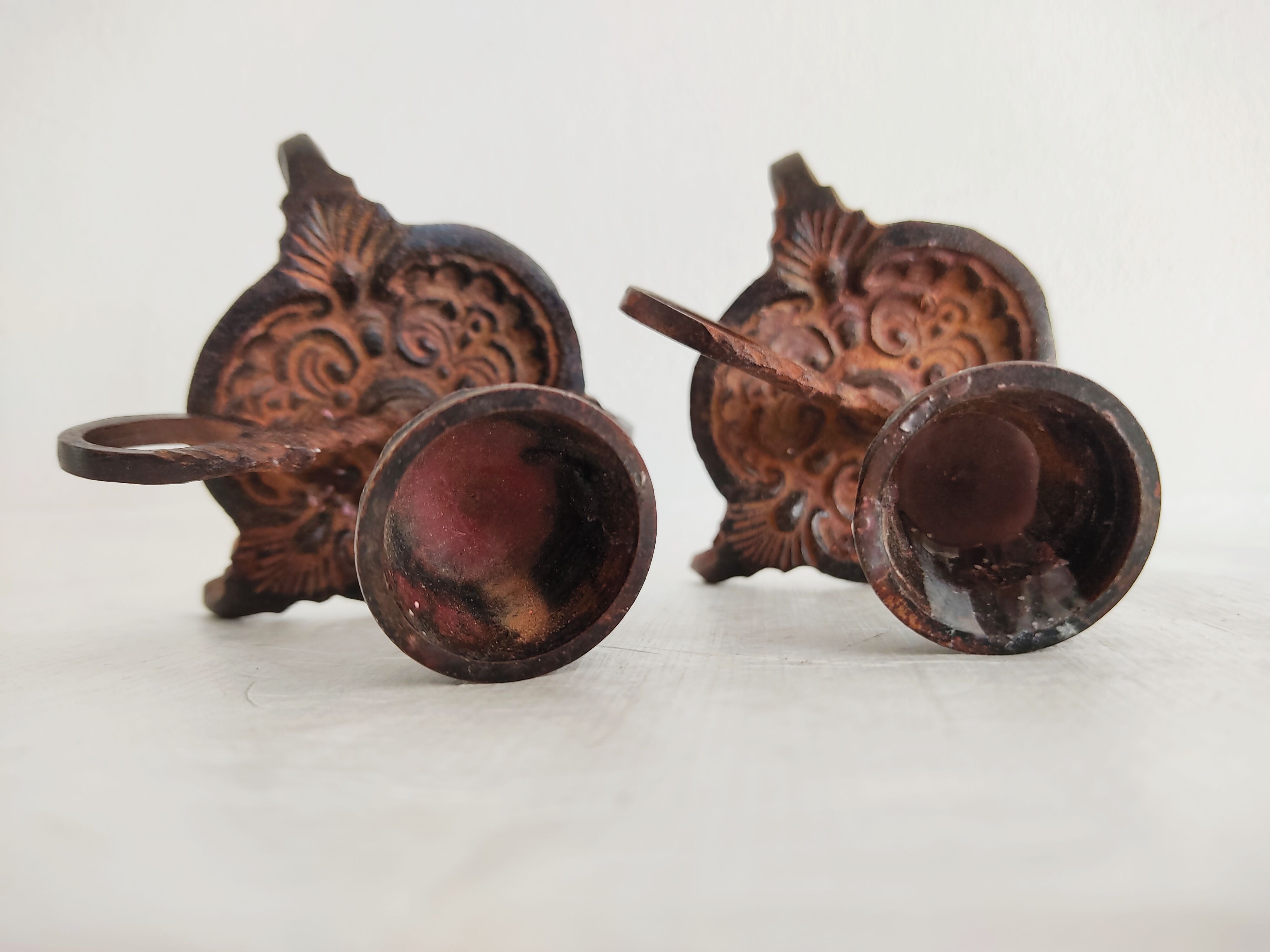 Pair of bronze hand-held candlesticks