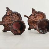 Pair of bronze hand-held candlesticks