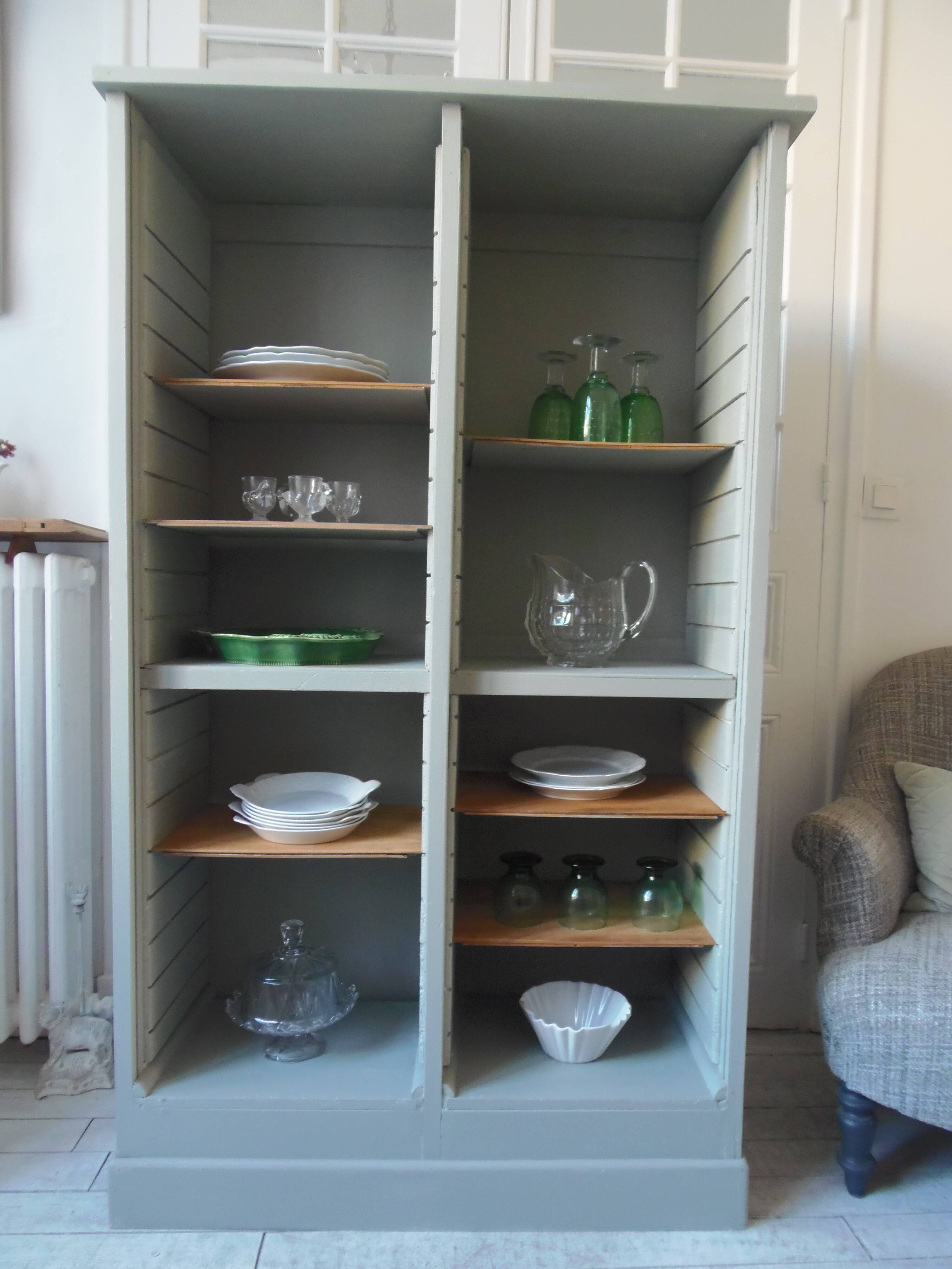 Vintage furniture transformed into a bookcase, verdigris patinated sideboard.