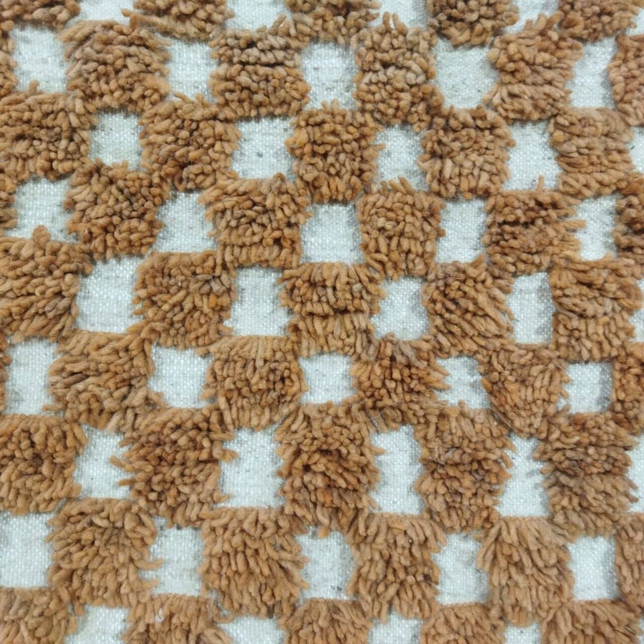 Moroccan Berber rug in ecru and camel wool with a graphic pattern, 245x150 cm.