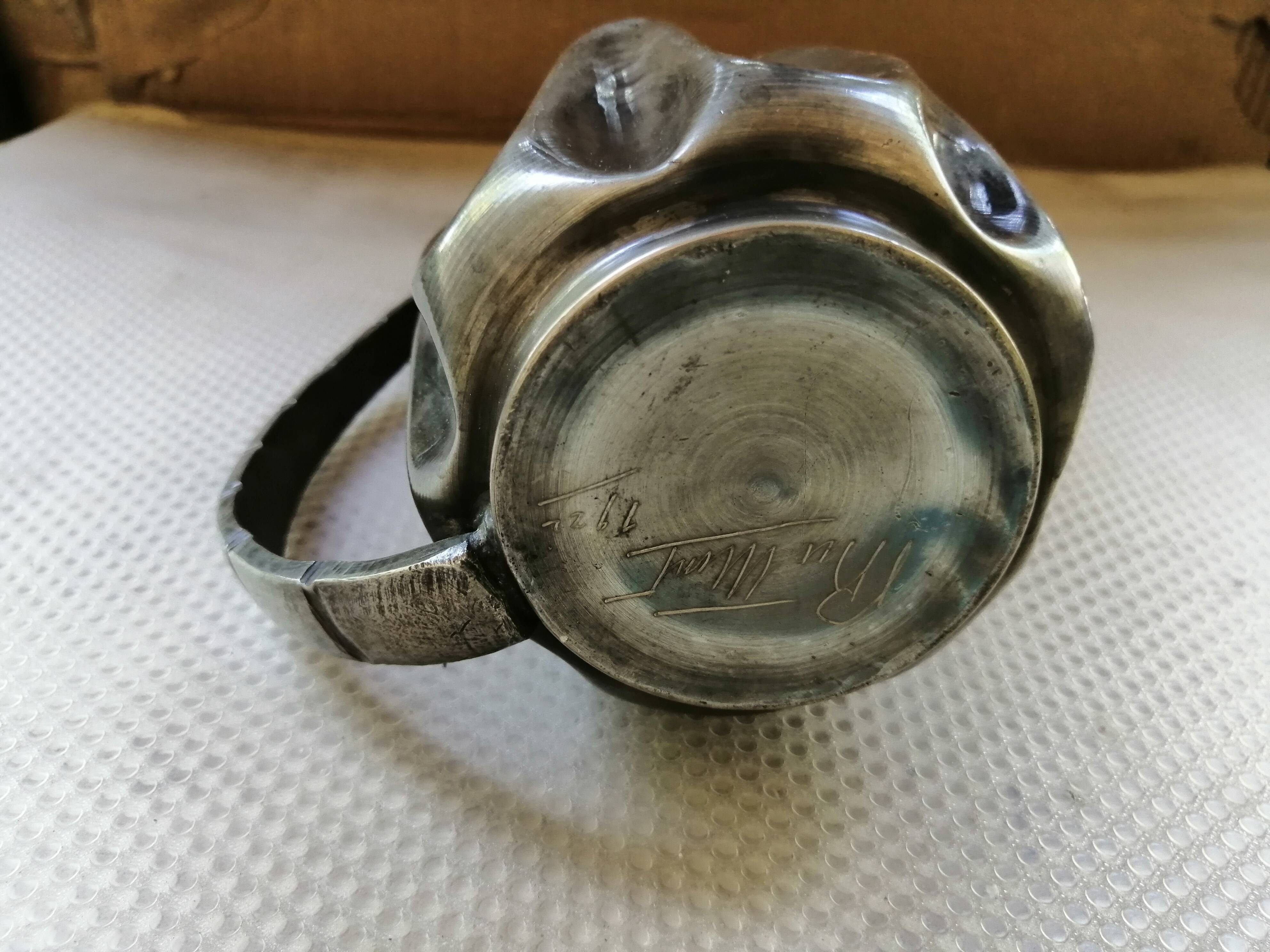 Tin pitcher signed and dated 1922