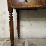 Wooden lady's desk says "happiness of the day"