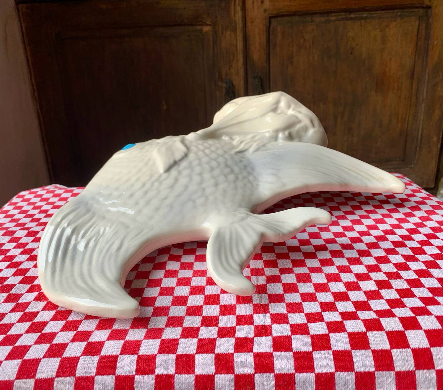 Large white ceramic fish to place.