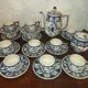Henriot Quimper earthenware coffee set with floral decoration and elegant blue