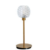 Table lamp with an antique glass lampshade and a gilded foot