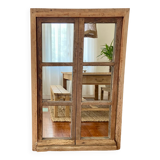 Mirror in old rustic window