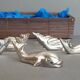 Lot 12 knife holders in the shape of a stylized whale or fish