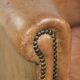 Vintage sheepskin club armchair finished with decorative nails
