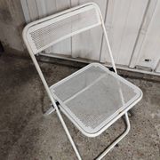 Perforated metal folding chair