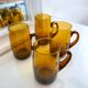 4 mugs/ mugs in vintage blown amber glass