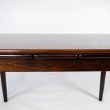 Dining table in rosewood with extentions, of danish design from the 1960s.