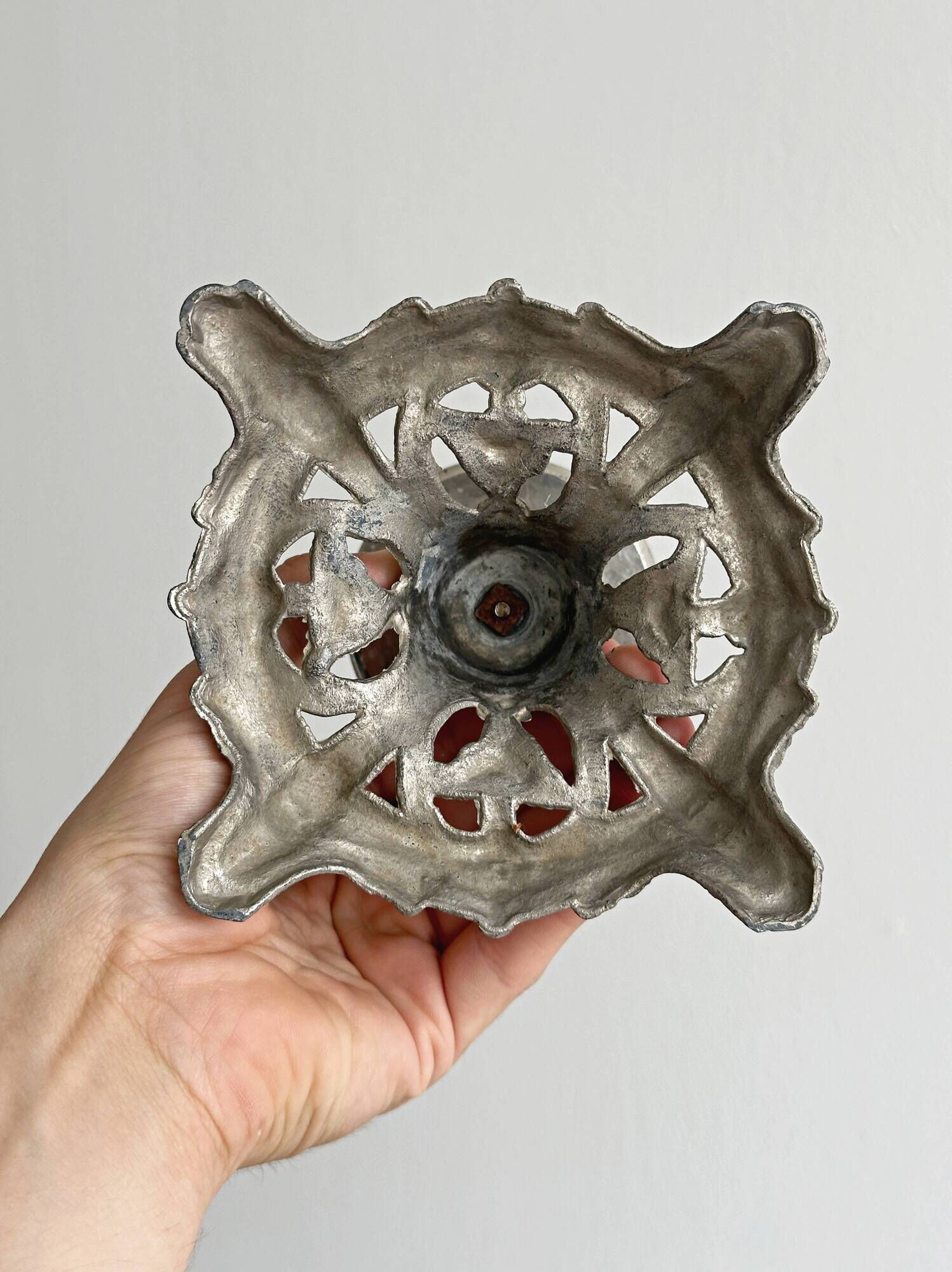 Candle holder with sculpted metal base, antique.