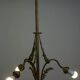 Antique pendant lamp with gold-coloured and ornate details and 3 fittings