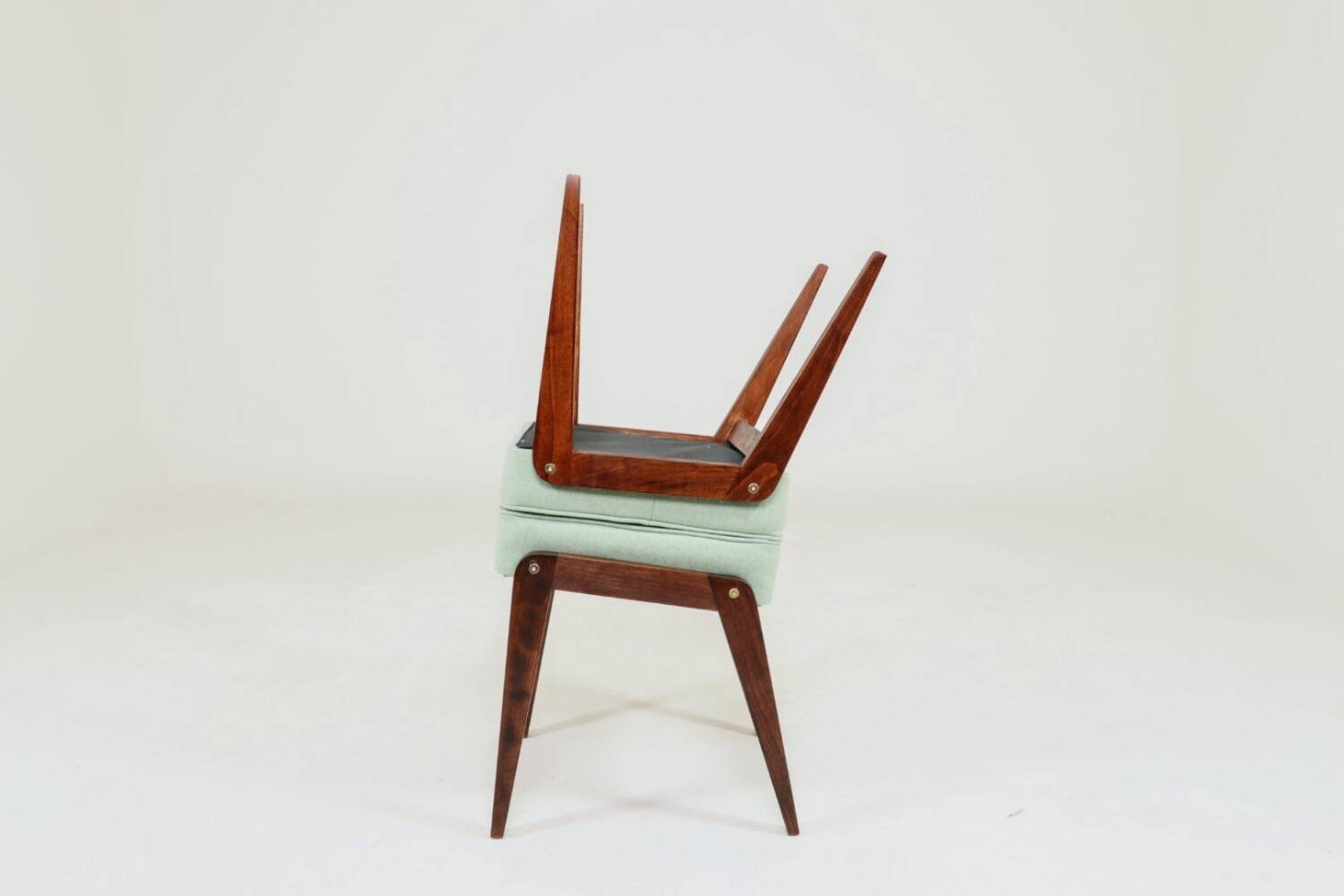 Vintage children's chair stool in pistachio green, mid-century modern design.