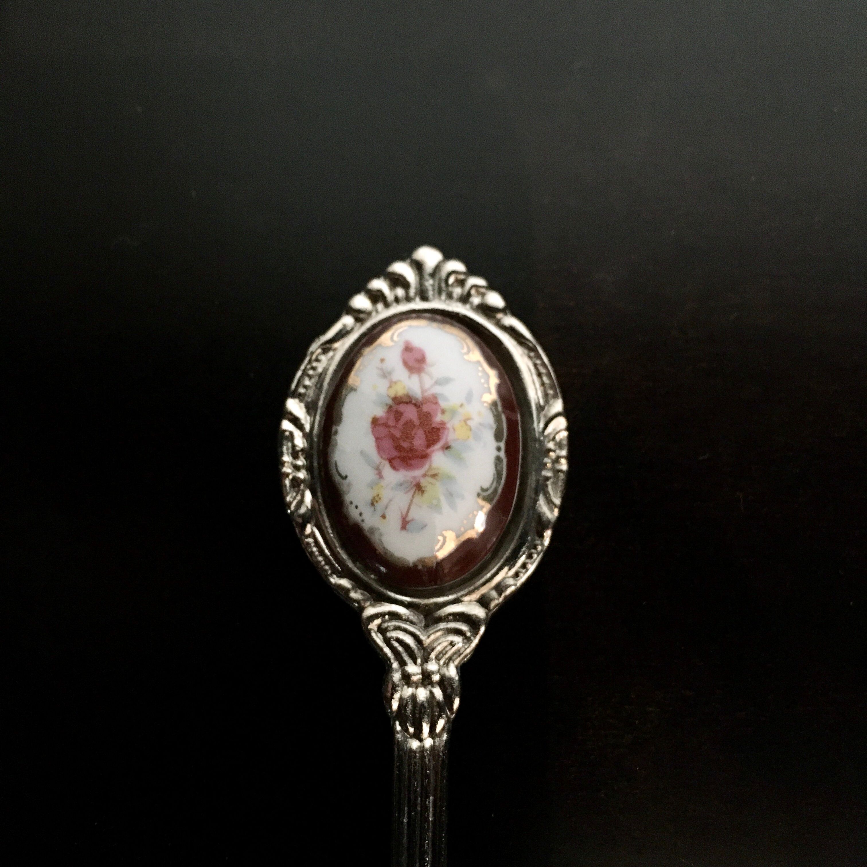 6 small spoons with porcelain medallion