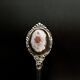 6 small spoons with porcelain medallion