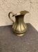 Vintage sculptural brass pitcher with a volute handle, satin finish (1950s)