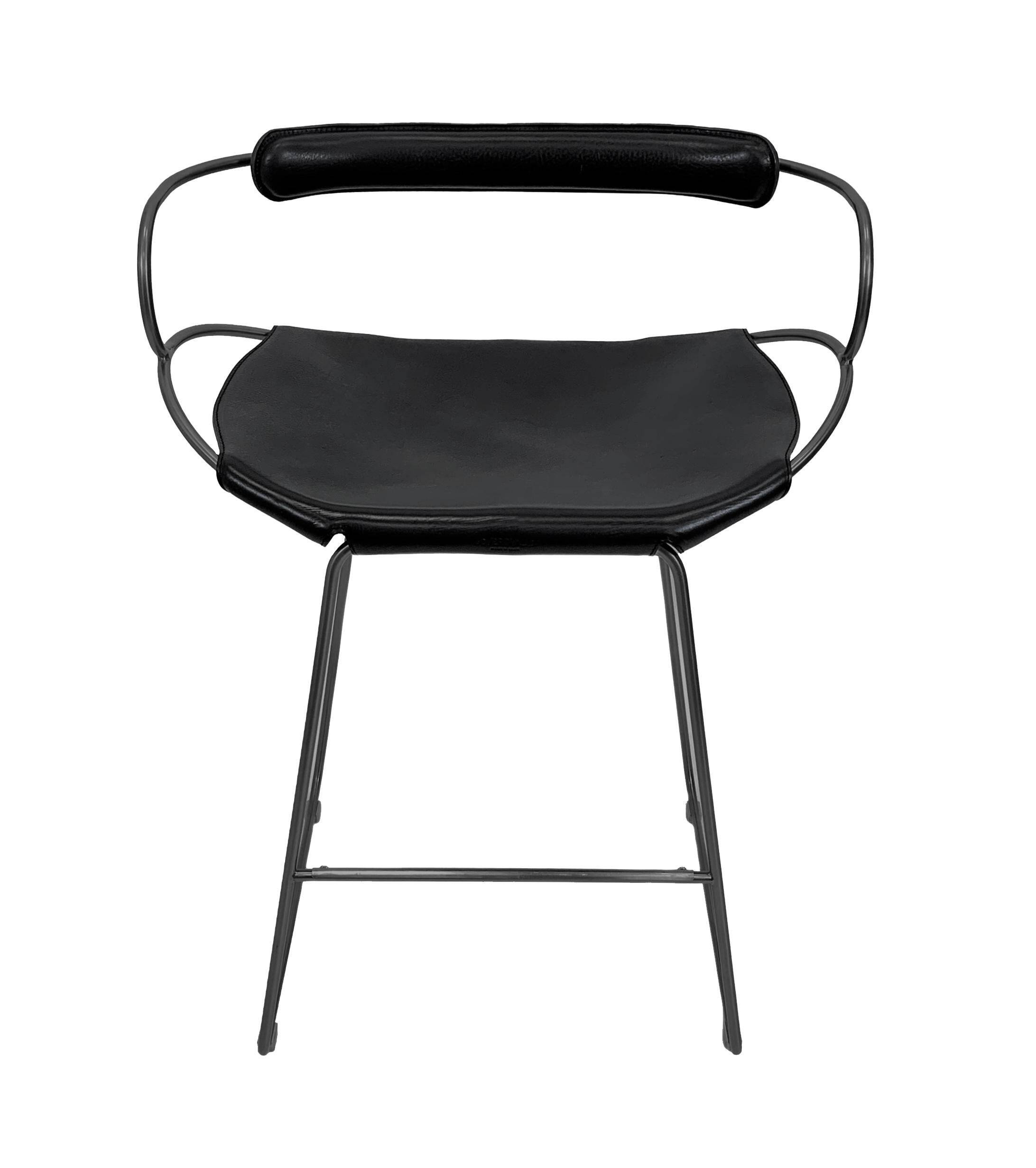 Contemporary sculptural bar stool c. Black smoked metal backrest and black leather.