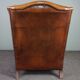 Eared armchair in patinated sheepskin