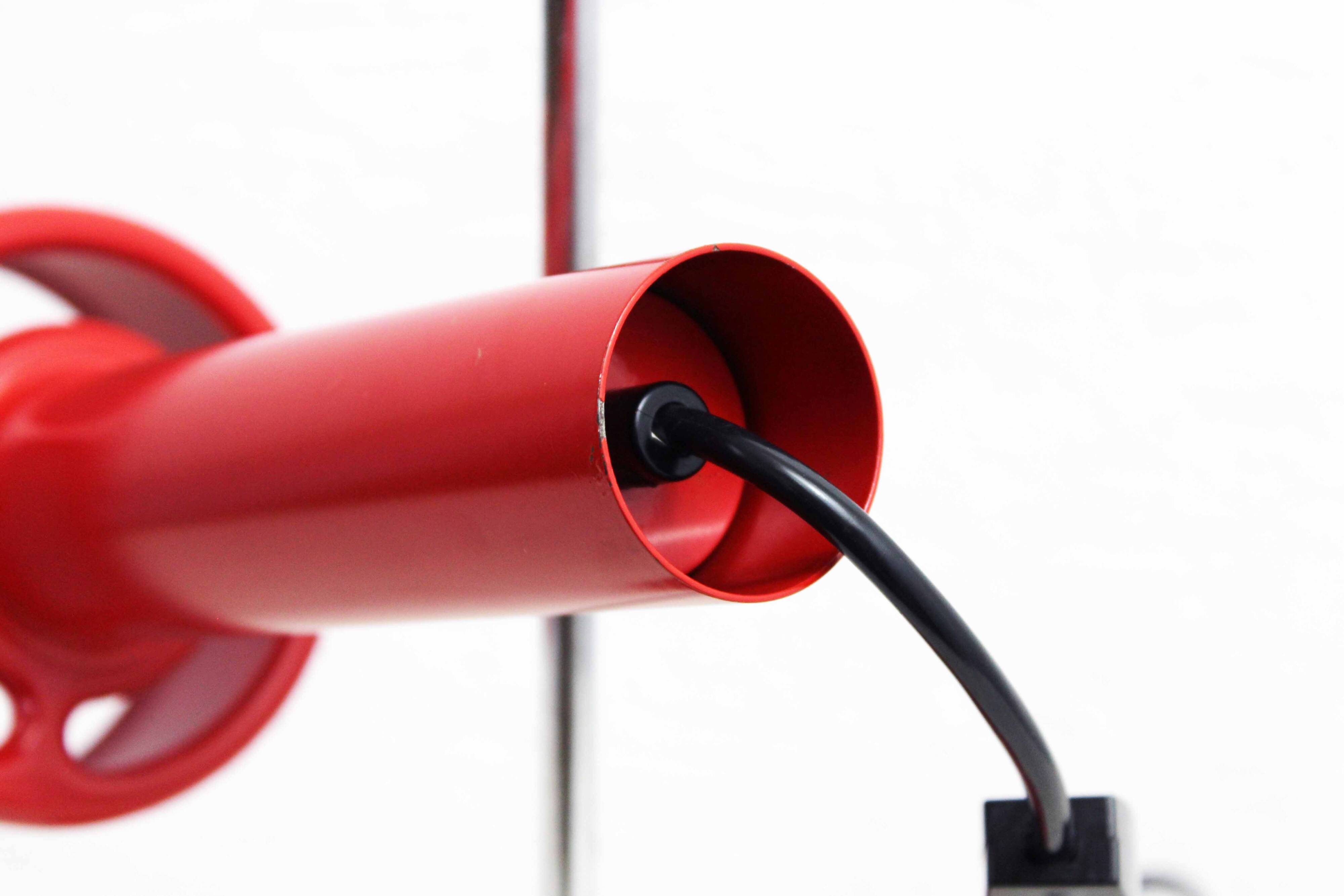 Red metal articulated desk lamp