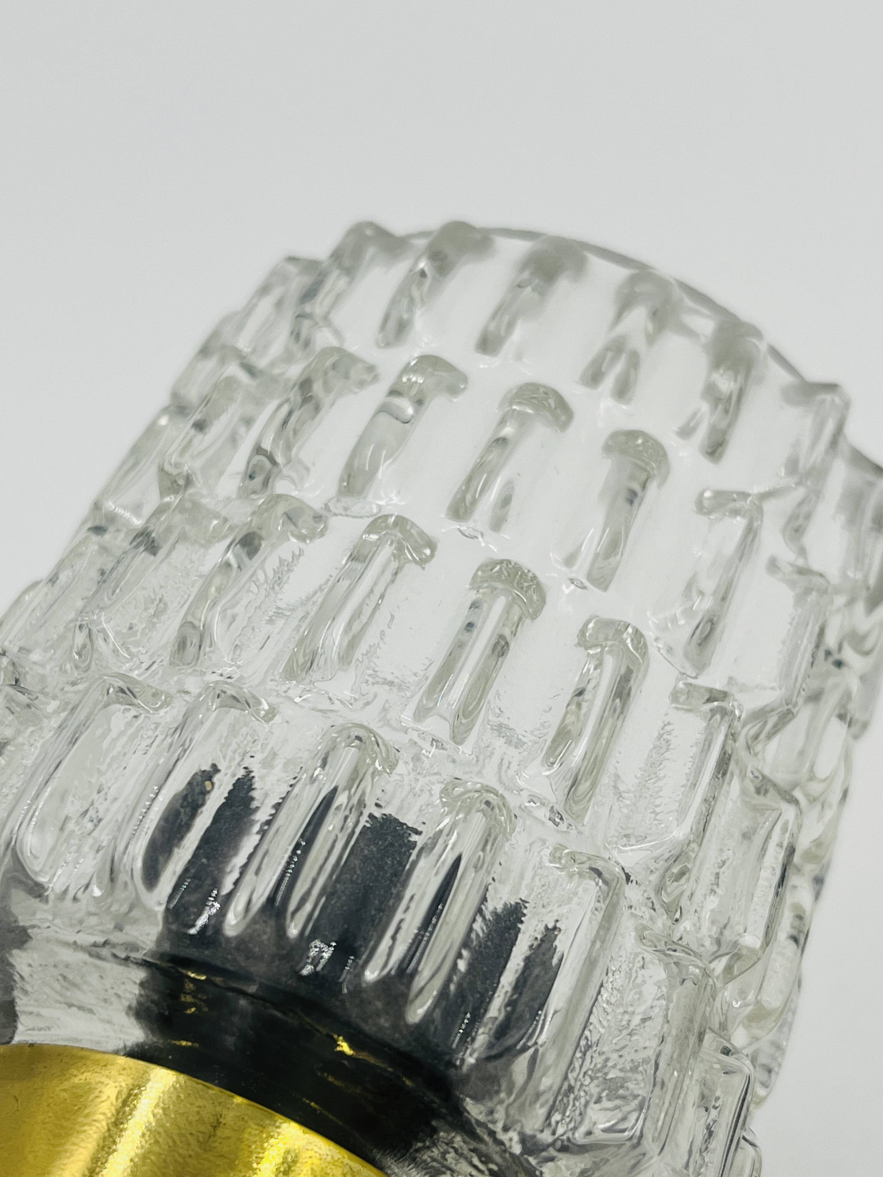 Pair of vintage wall lights with textured glass, attributed to Maison Arlus.
