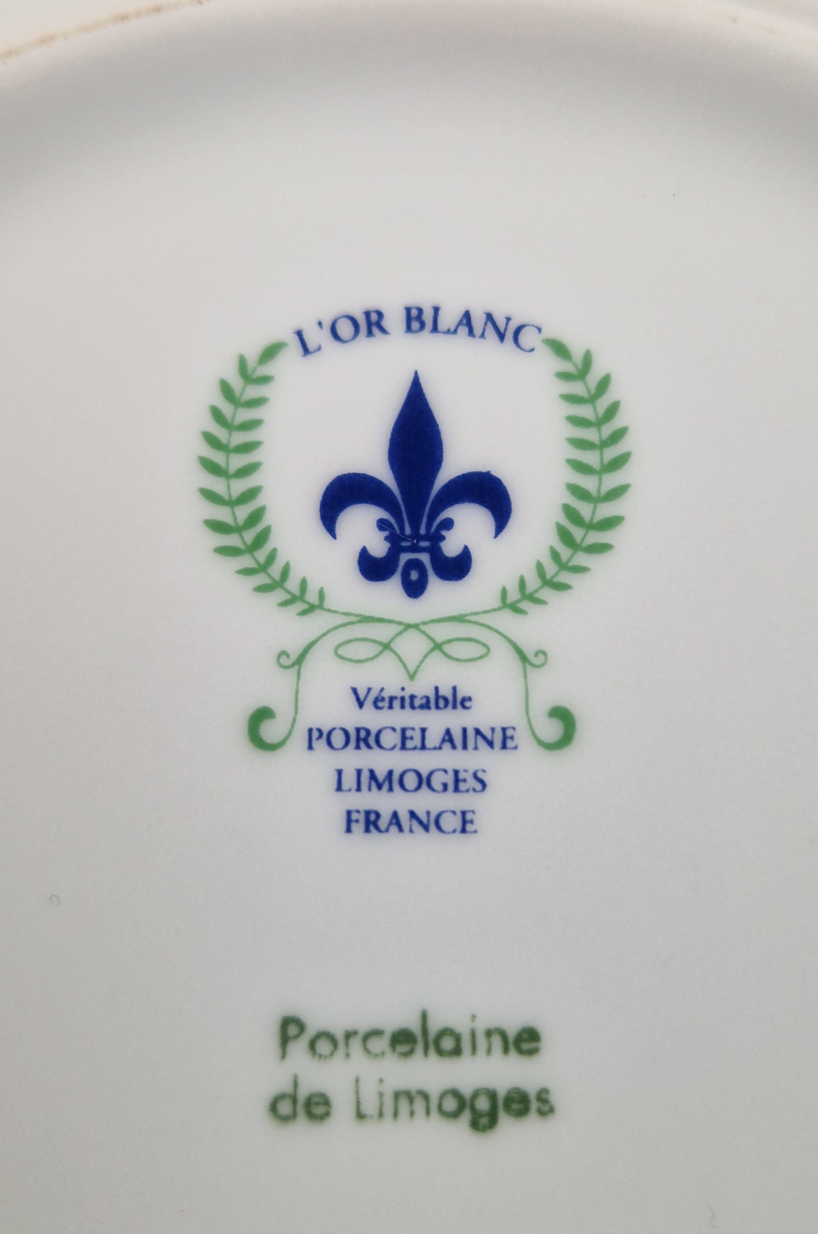 6 deep plates made of Limoges porcelain with a paradise bird design.