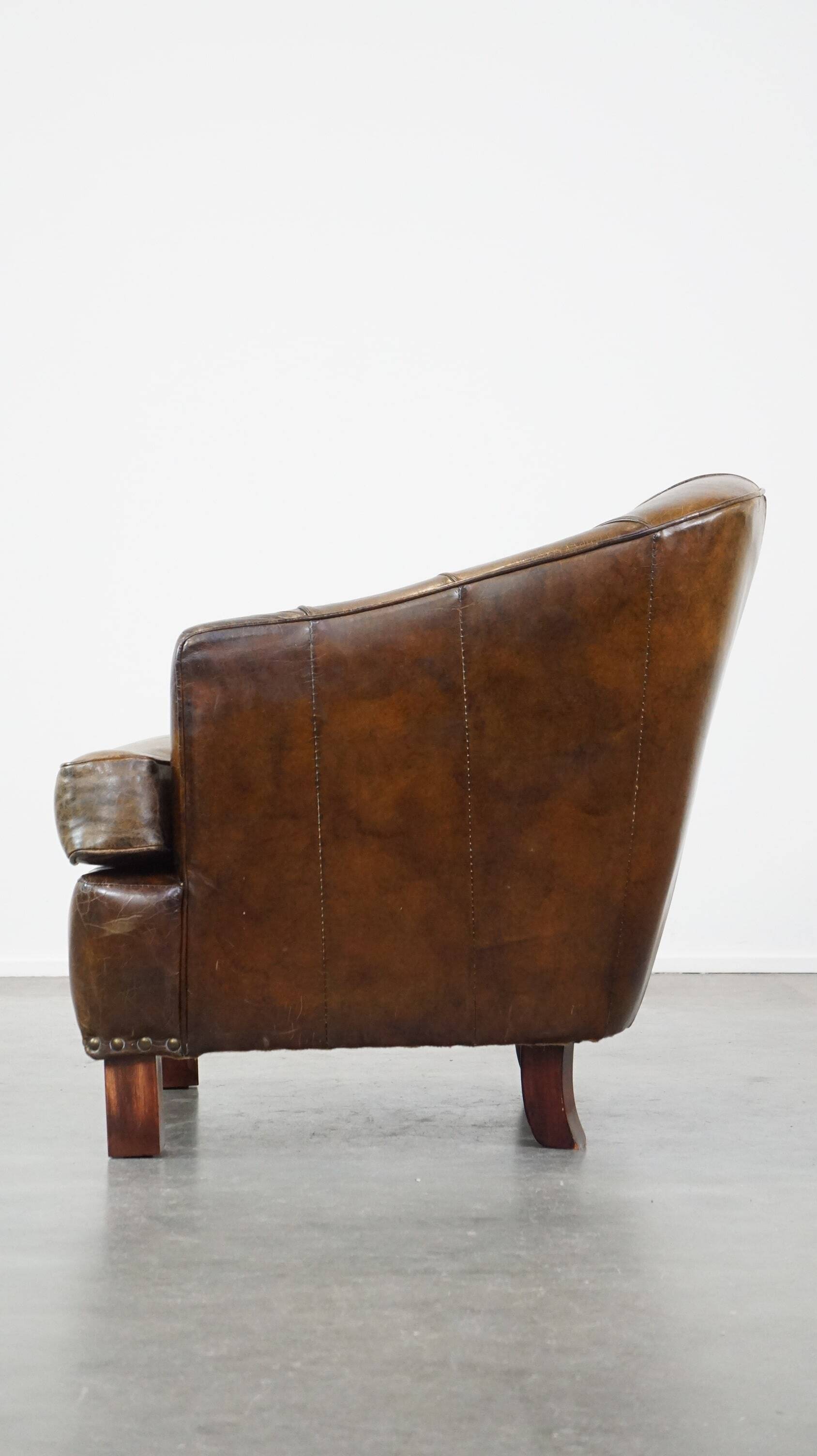 Stylish armchair with a unique design and beautiful finish, made of leather