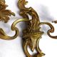 Pair of Rococo wall sconces in gilded bronze, Hollywood Regency, from the years.