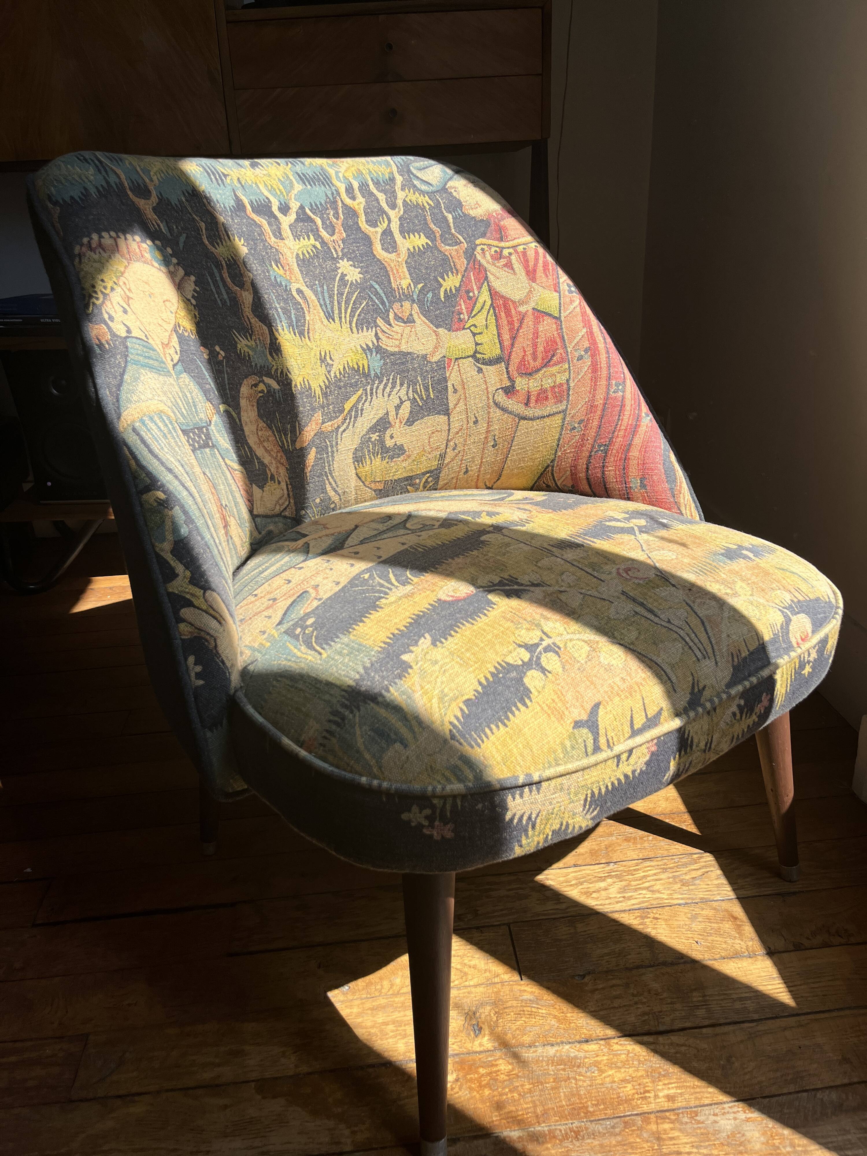 J. Tenreiro, Brazil. Concha armchair with tapered legs, Cluny tapestry 1400.