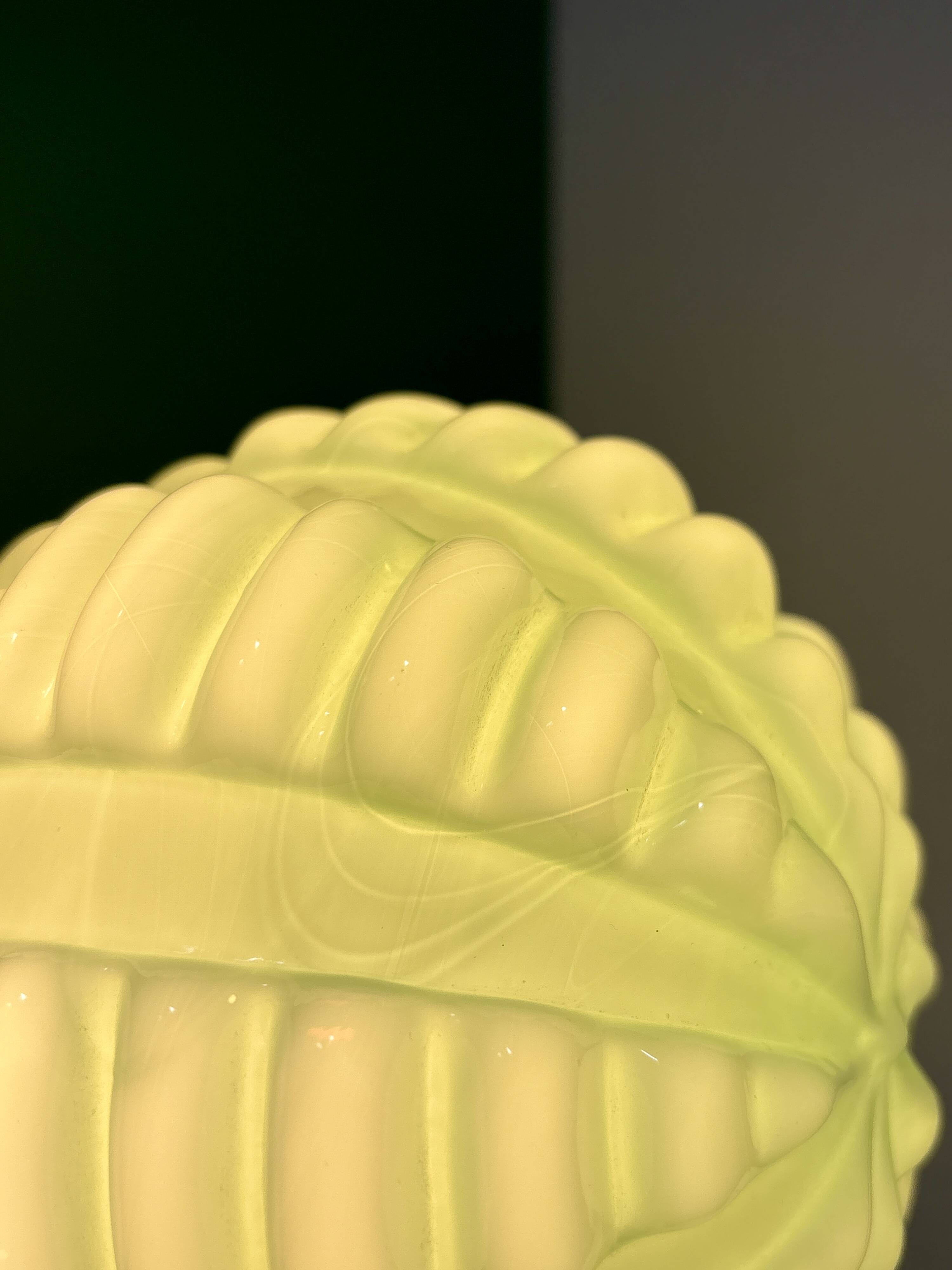 Vintage Art Deco globe wall light in pale green opaline.