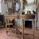 Console with 4 legs from the end of the 19th century in gilded wood in the Louis XVI style.