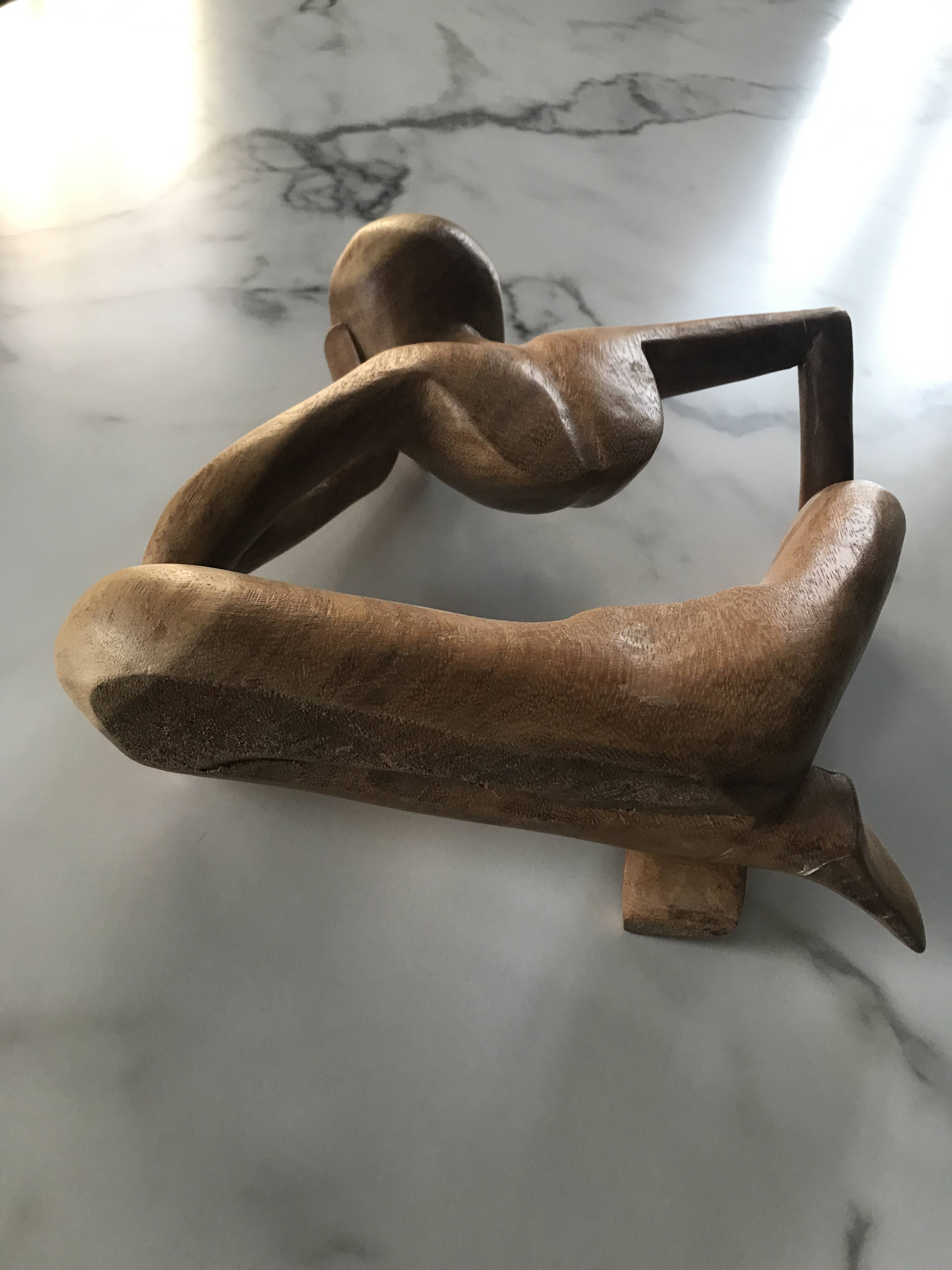 Pensive man wooden statue