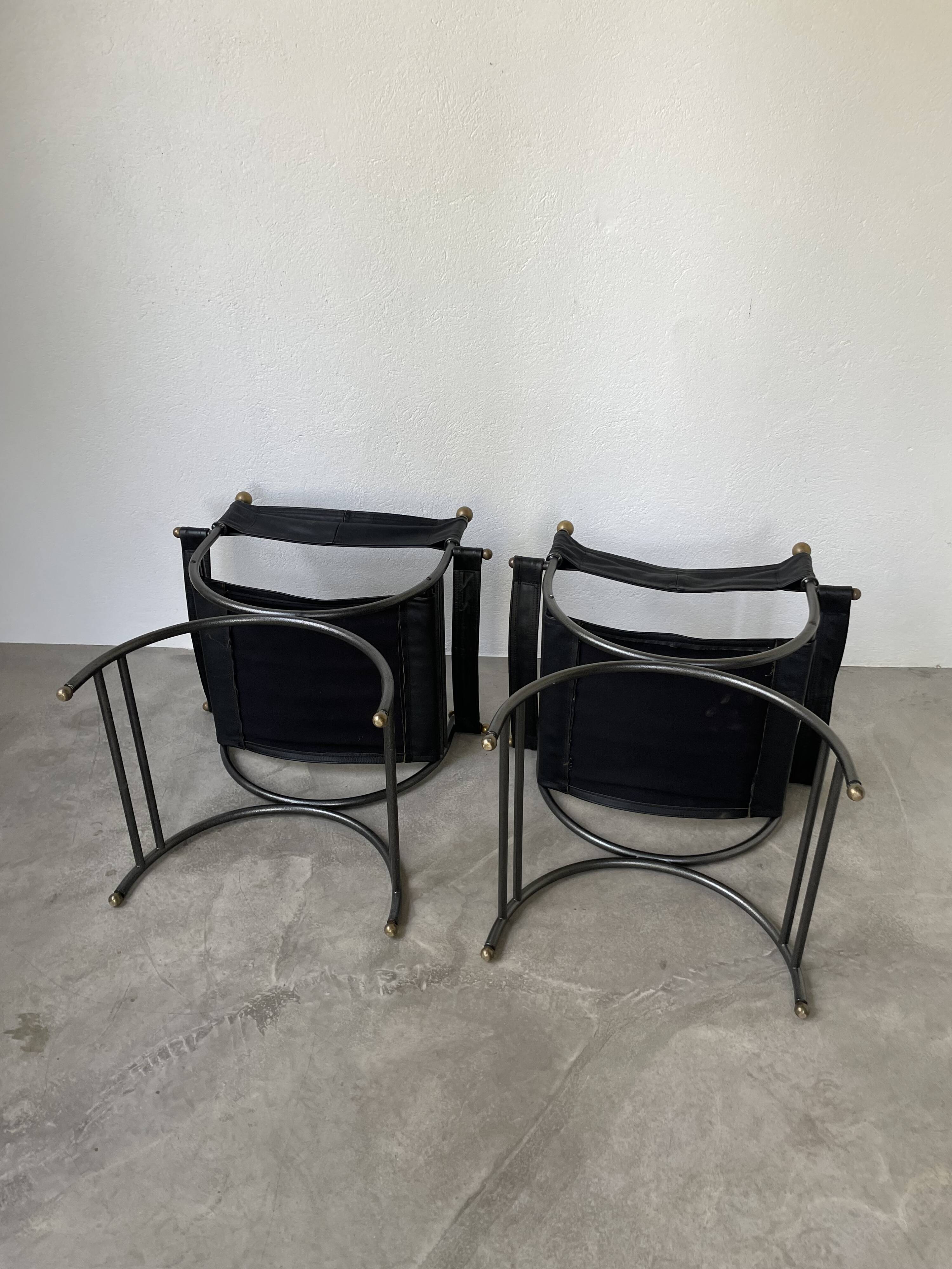 Pair of leather “curule” emperor armchairs