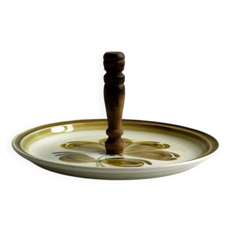 Ceramic cheese dish decorated with green floral pattern.