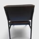 Modernist armchair in black faux leather and metal – 1960s